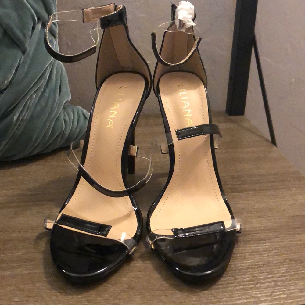 Clear and black patent leather stilettos